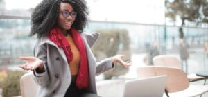 girl comapring in front of laptop