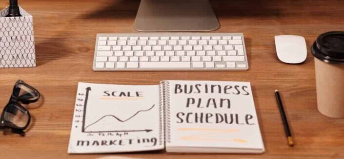 Business Plan Schedule Written on the Notebook